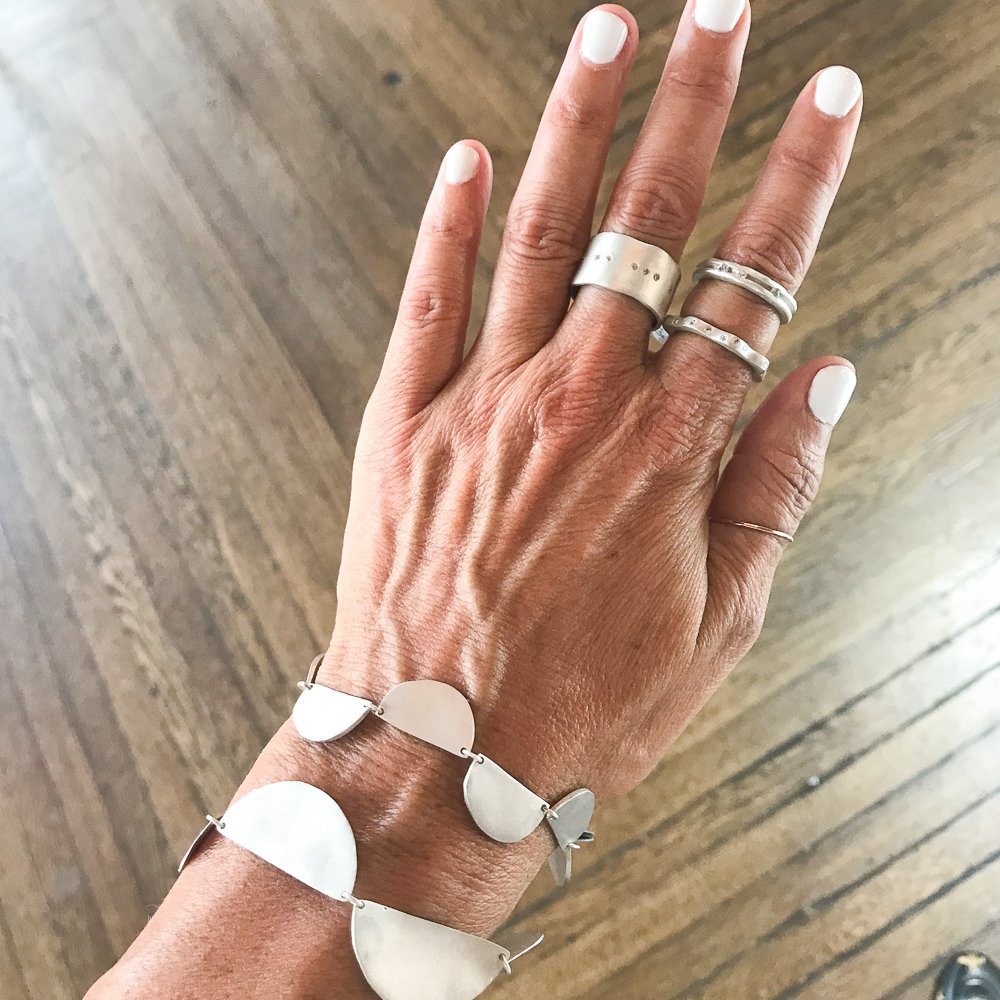 sterling silver bracelets and rings with diamonds by jewelry designer Saundra Messinger