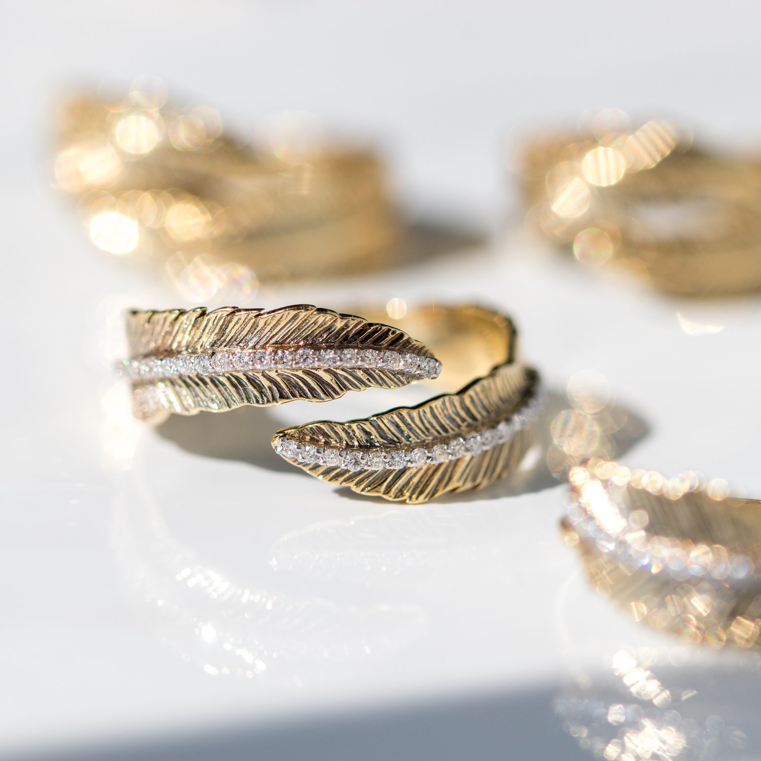 Kismet: 14K yellow gold double row feather ring with white diamonds .20 TCW