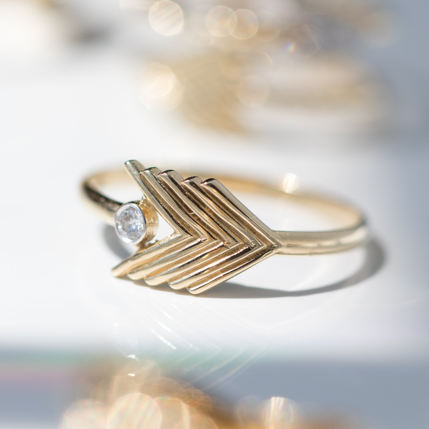 Kismet: 14K yellow gold sagita chevron single white diamond ring .04ct