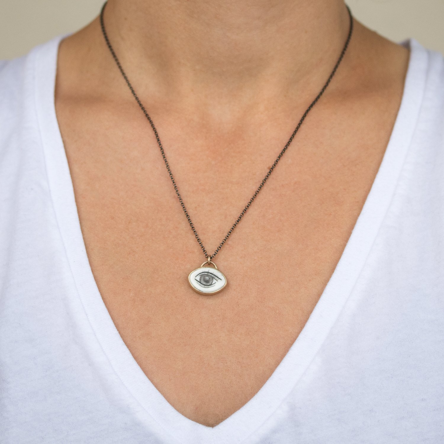 Hannah Blount: Oxidized sterling silver and 14K gold lovers eye quahog shell scimshaw necklace