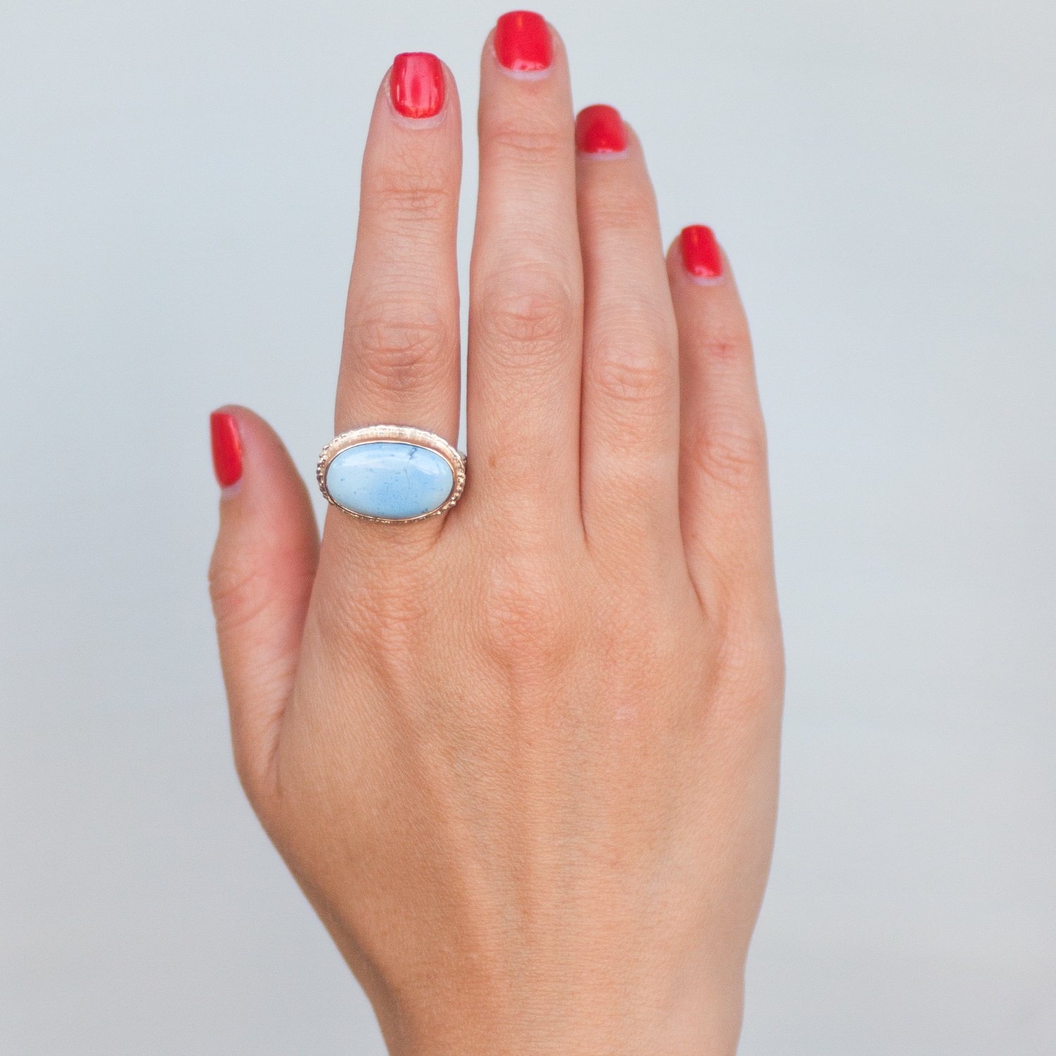 Jamie Joseph: SS & 14k gold ring w/ small oval Kazakhstani turquoise on lava platform and textured band size 7.5 5/8 x 7/8