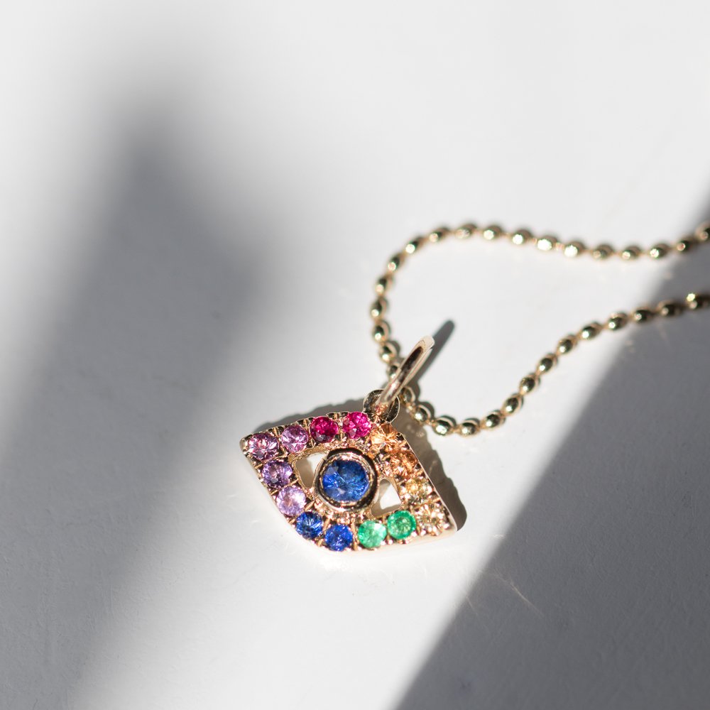 Evil Eye Rainbow Sapphire charm necklace in 14K yellow gold by jewelry designer Sydney Evan