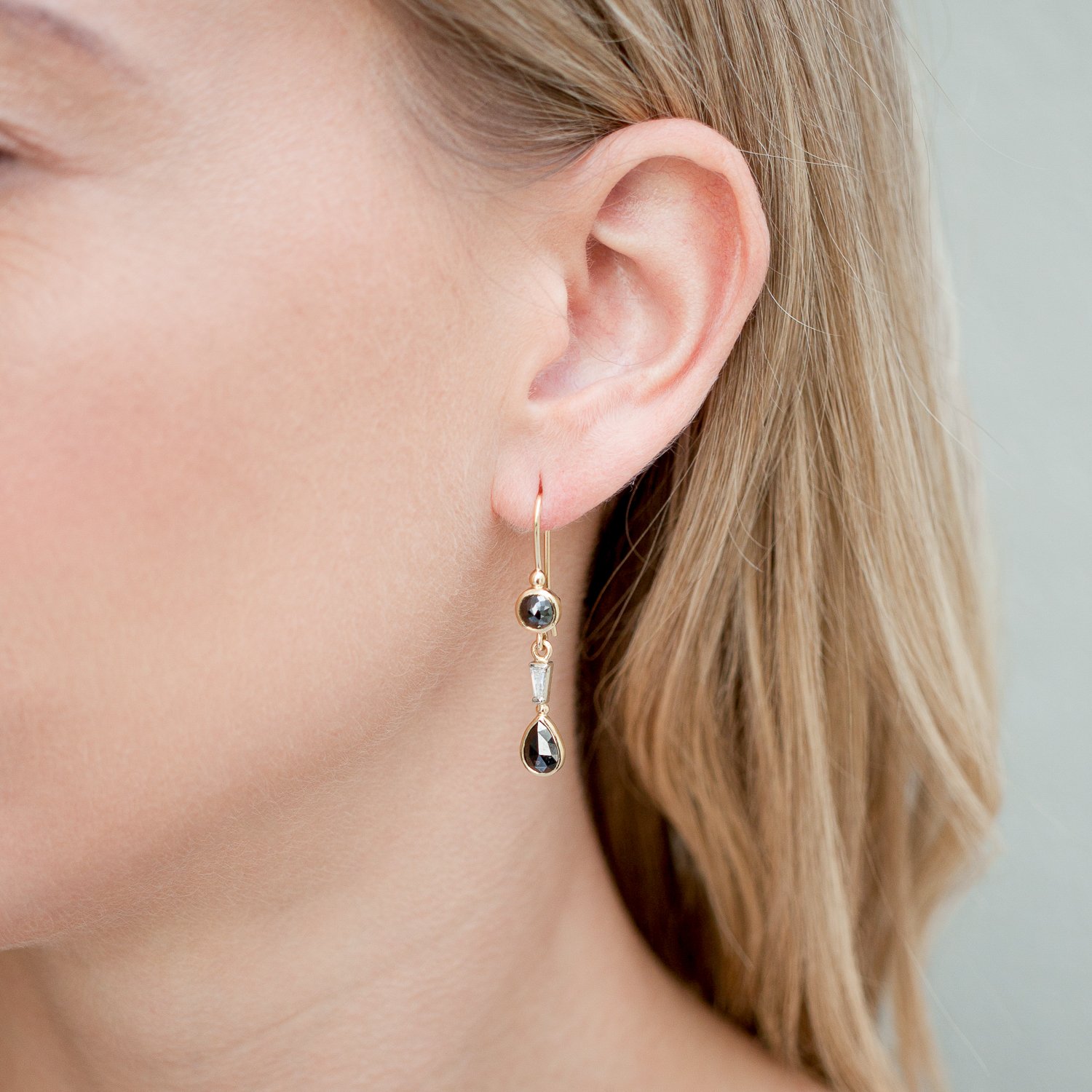 Alison Shiboski: 18K and 14K yelow gold dangle earring with 2.88TCW black diamonds and .24TCW white baguette diamonds