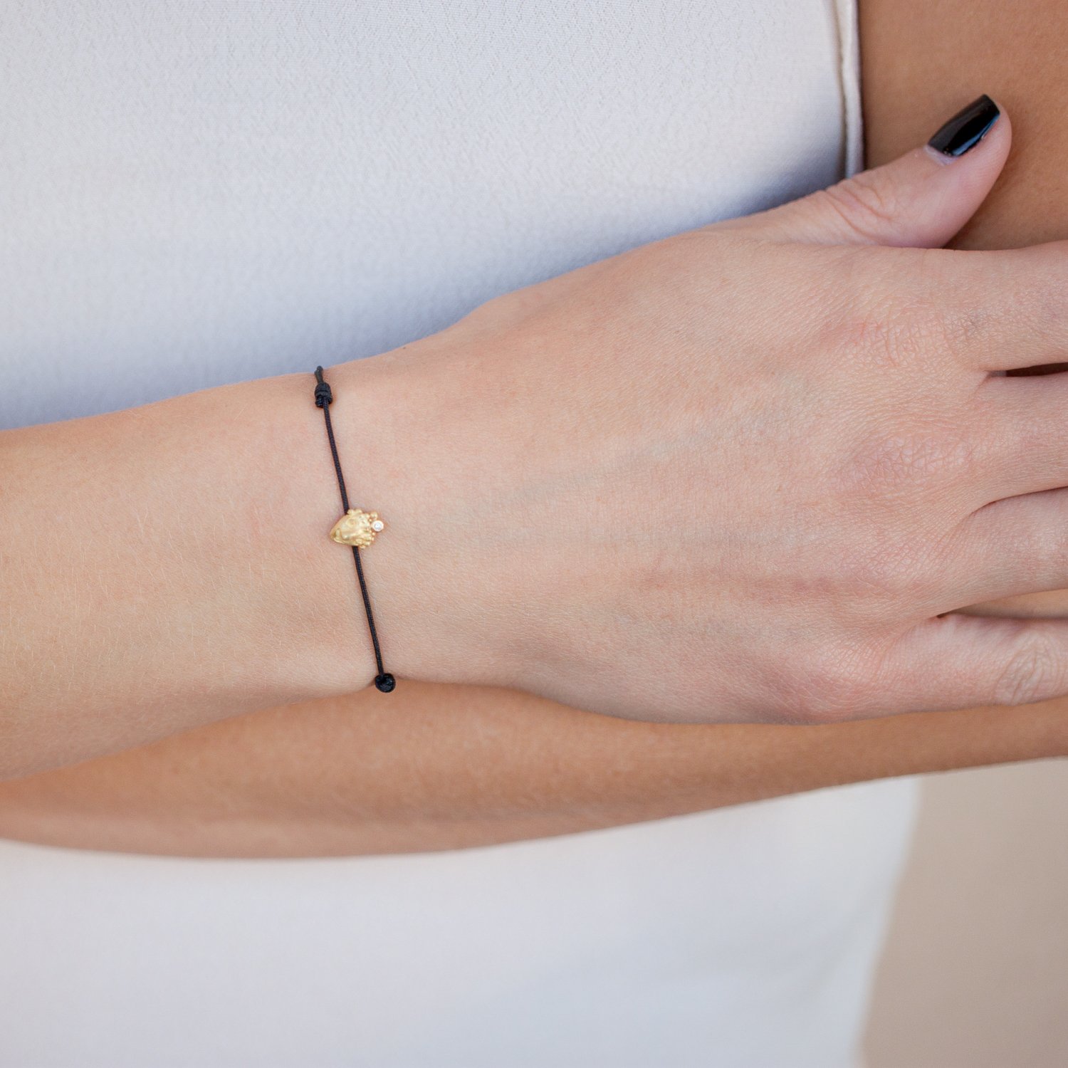 Lene Vibe: Bracelet, Face, 18K gold, Diamond, .01ct, 5/16" x 1/4", black nylon cord.