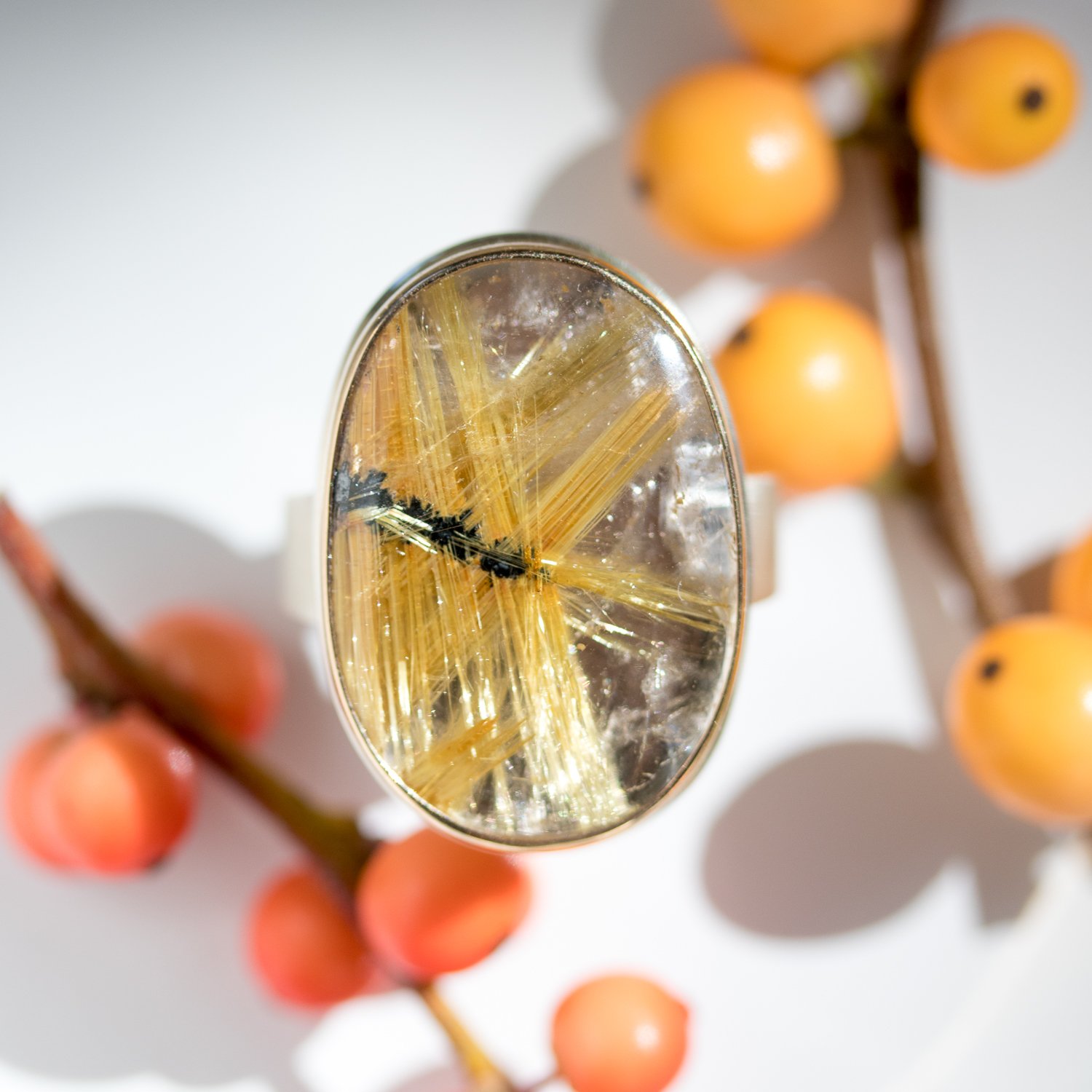 Oval rutilated quartz ring by jewelry designer Jamie Joseph at NEWTWIST