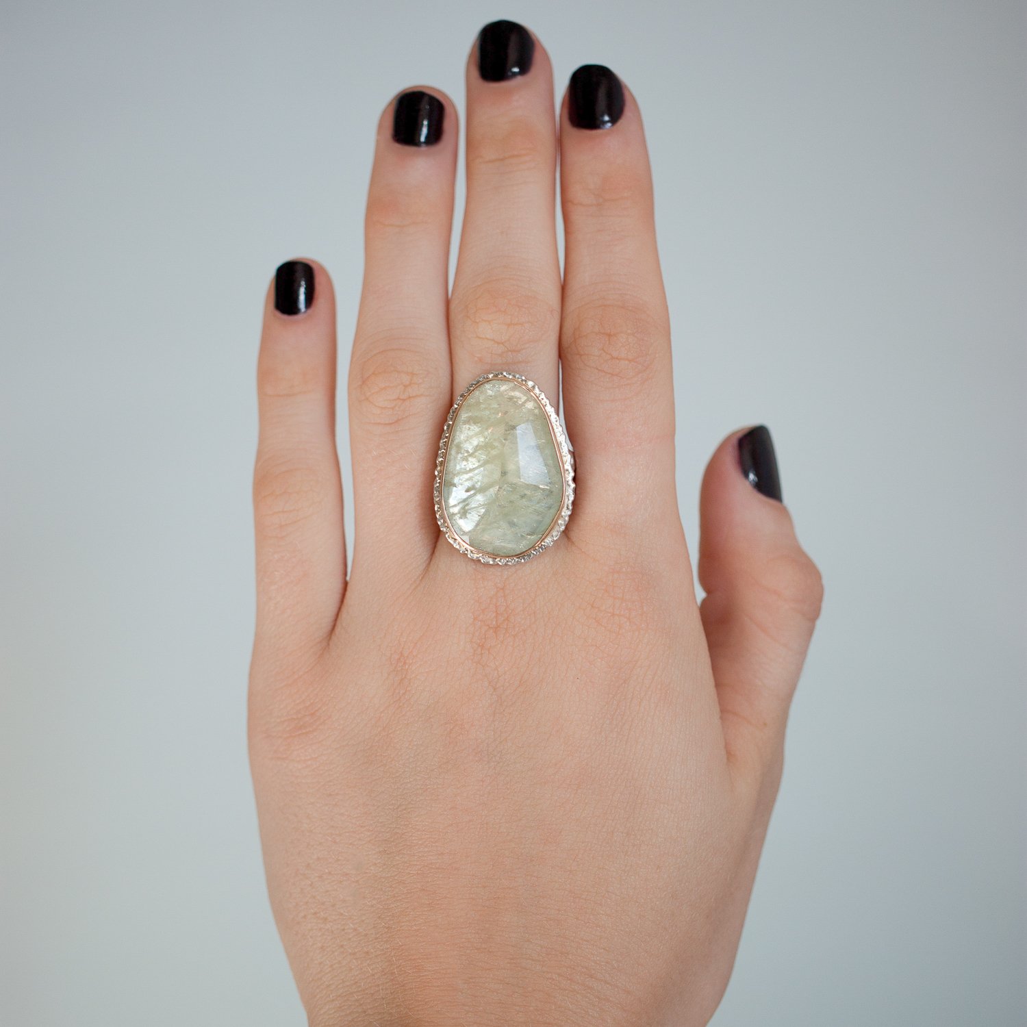 Jamie Joseph: SS and 14K gold ring with vertical asymmetrical faceted green sapphire on lava platform and madrona band size 8 1x11/16