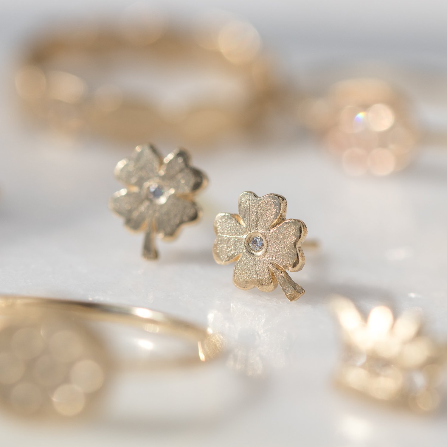 clover post earrings with white diamonds in 14k yellow gold by jewelry designer Victoria Cunningham at NEWTWIST
