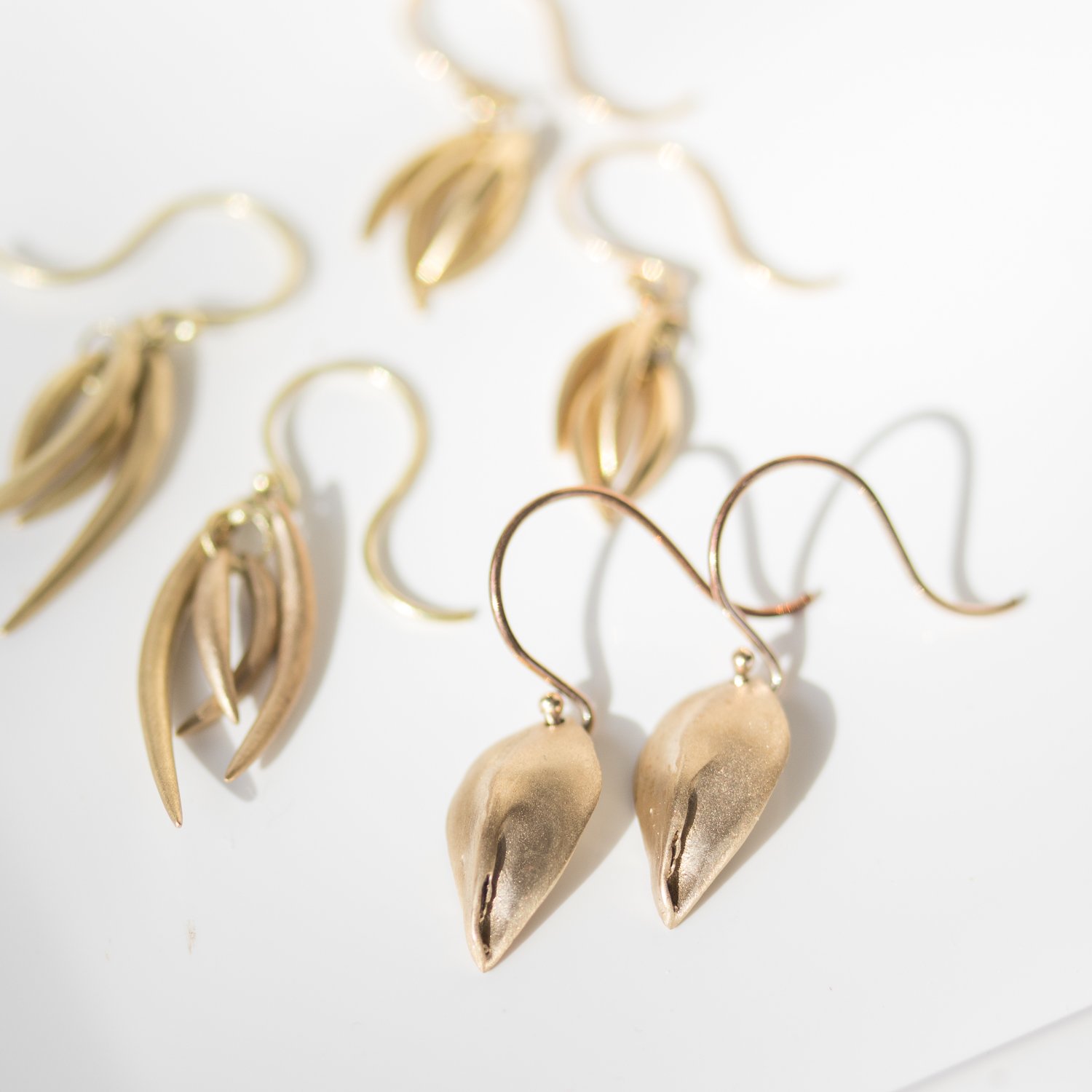 gold earrings by Ten Thousand Things at NEWTWIST