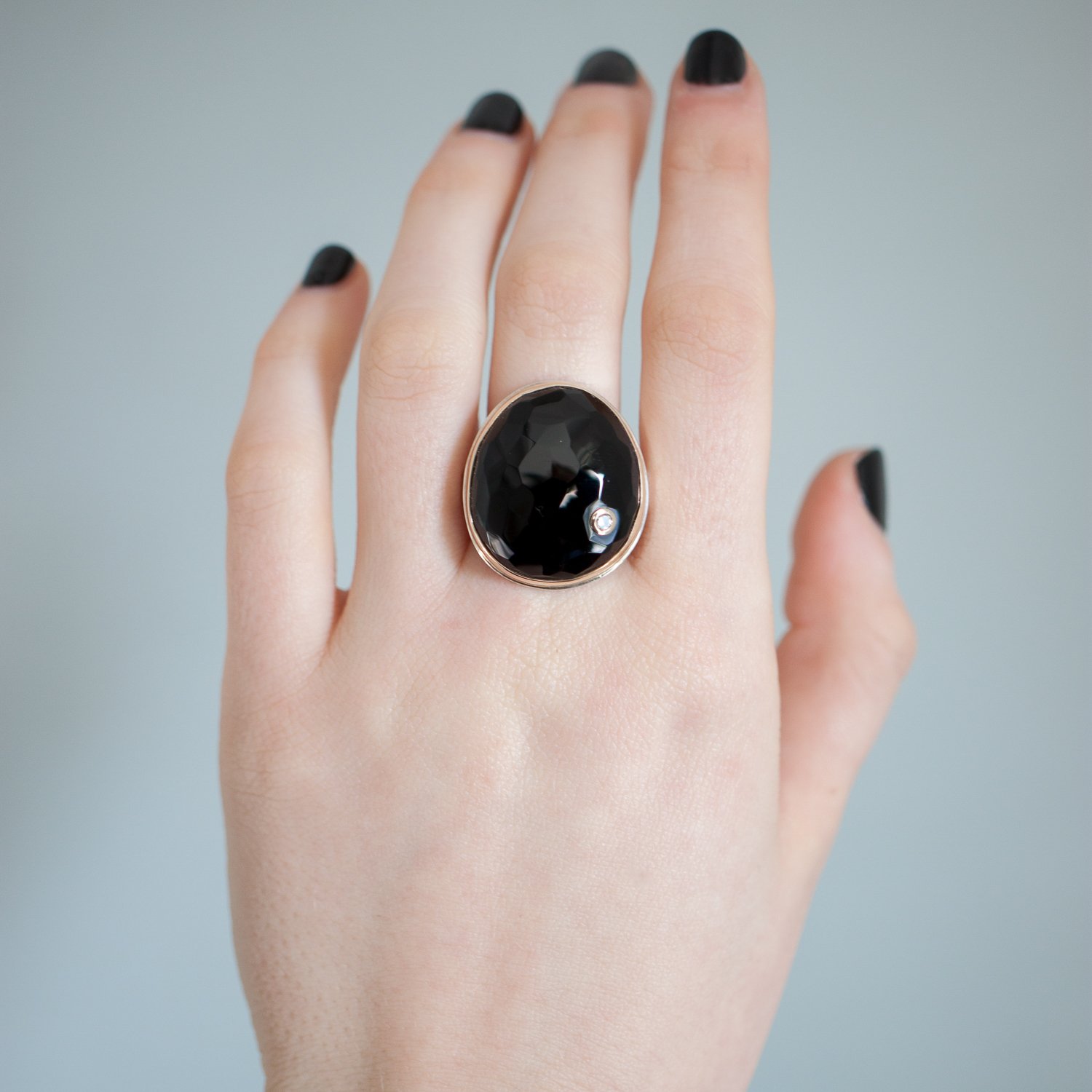Jamie Joseph: Sterling silver & 14K gold ring with vertical hand faceted asymmetrical black onyx and .06ct diamond on Y band