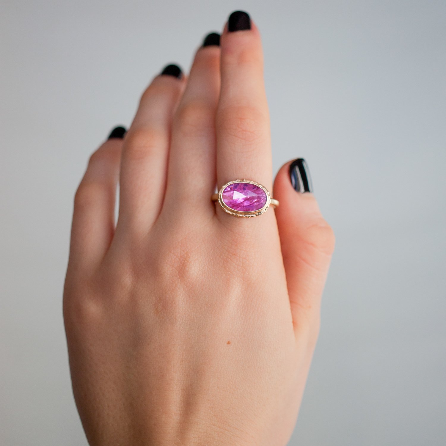 Jamie Joseph: 14K gold ring with oval rose cut Mozambique ruby on ruffled platform and sand band Size 7