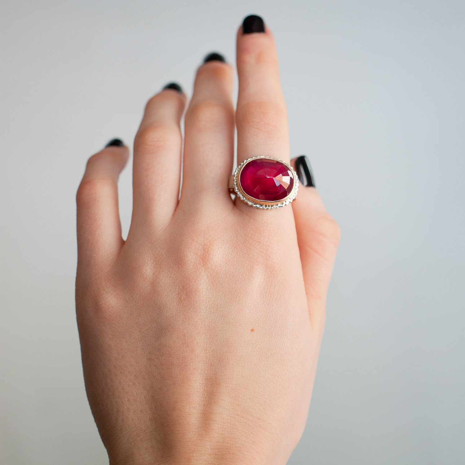 Jamie Joseph: 14K gold and sterling silver ring with oval inverted African ruby on lava platform on live edge band Size 7
