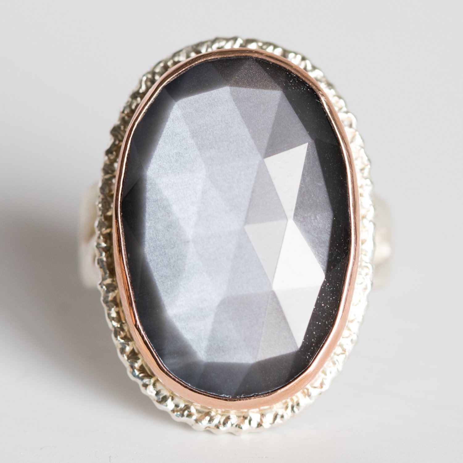 Jamie Joseph: 14K rose gold and sterling silver ring with vertical oval rose cut grey moonstone on lava platform and madrona band Size 8