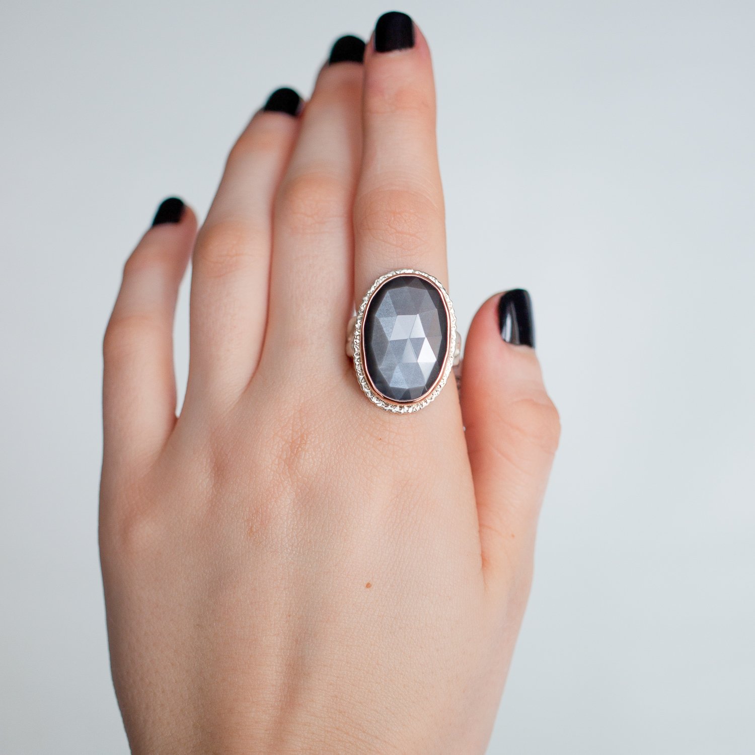Jamie Joseph: 14K rose gold and sterling silver ring with vertical oval rose cut grey moonstone on lava platform and madrona band Size 8