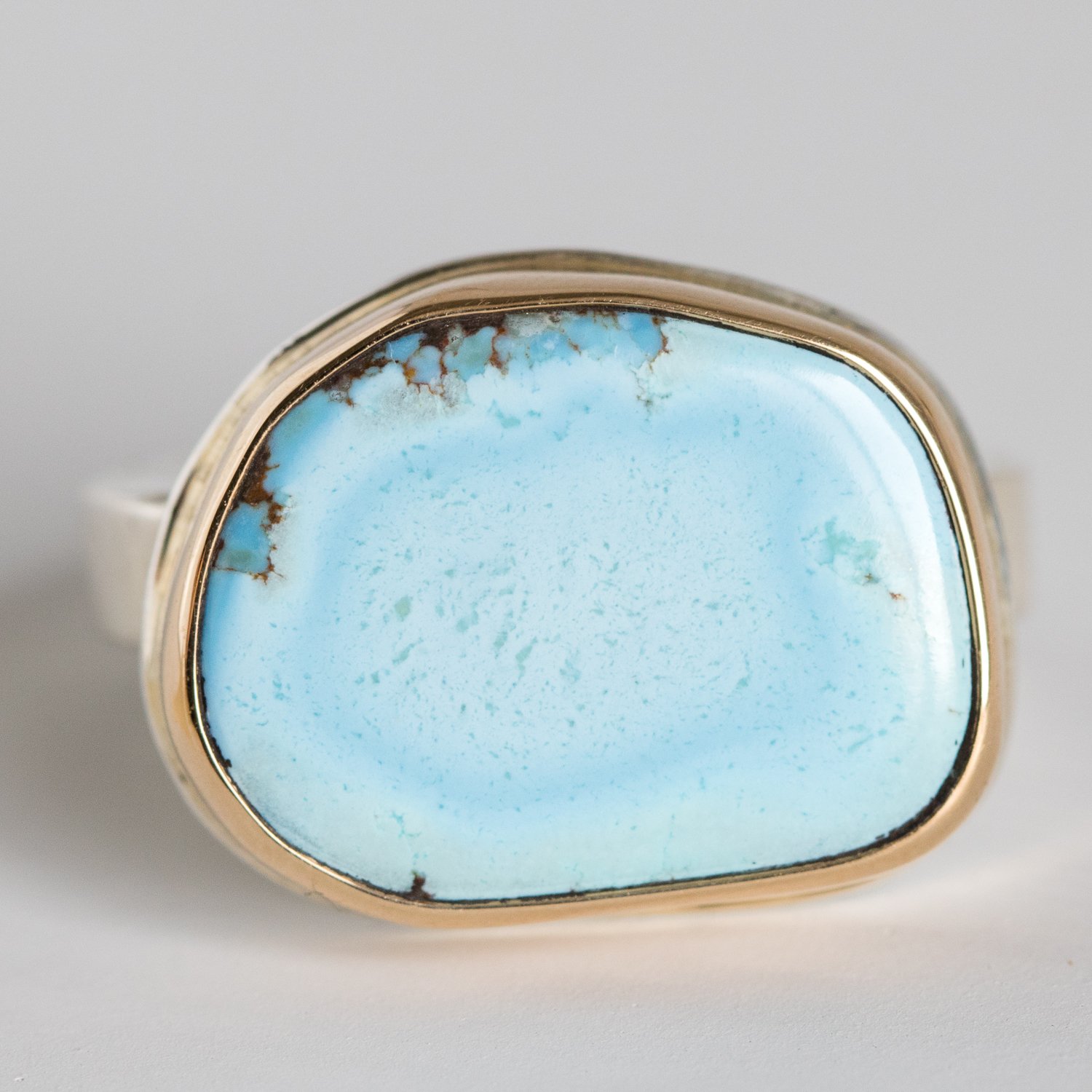 Jamie Joseph: 14K gold and sterling silver ring with asymmetrical Kazakhstani turquoise on skinny smooth band Size 6.75