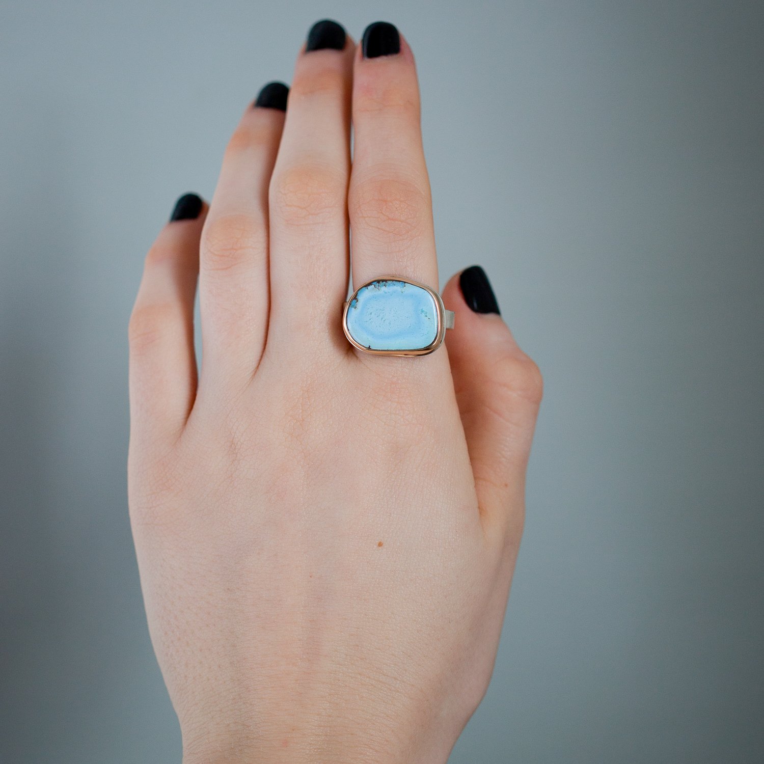 Jamie Joseph: 14K gold and sterling silver ring with asymmetrical Kazakhstani turquoise on skinny smooth band Size 6.75