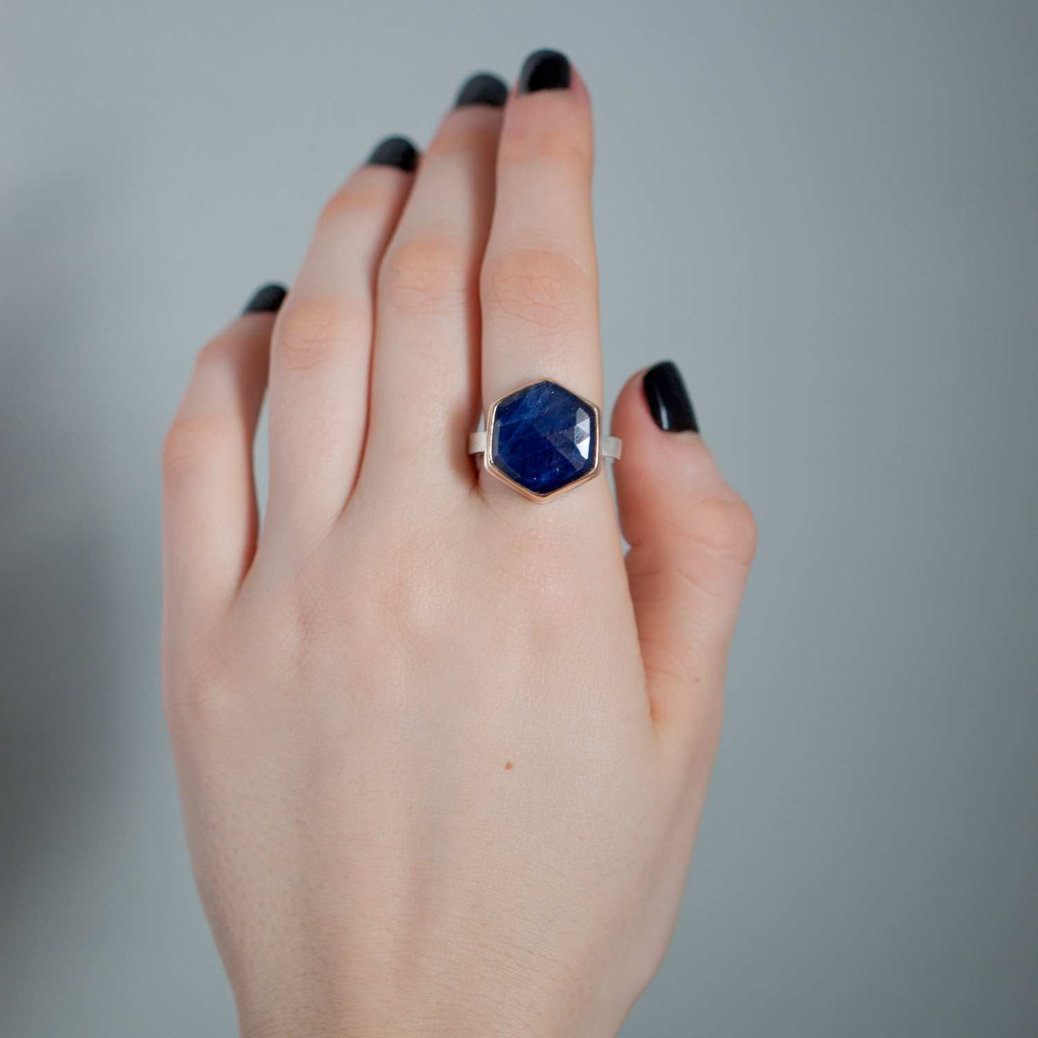 Jamie Joseph: 14K gold and sterling silver ring with medium hexagonal rose cut blue sapphire on X band Size 7