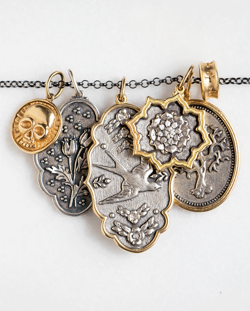 gold and silver charms by Erica Molinari