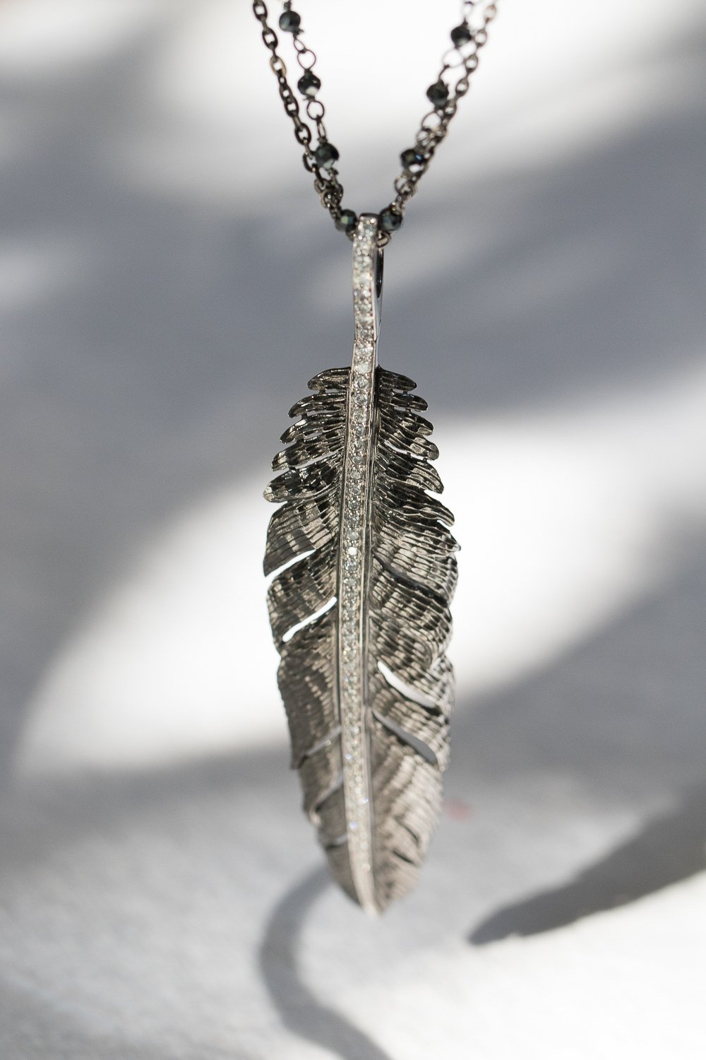 Silver feather pendant necklace by Michael Aram