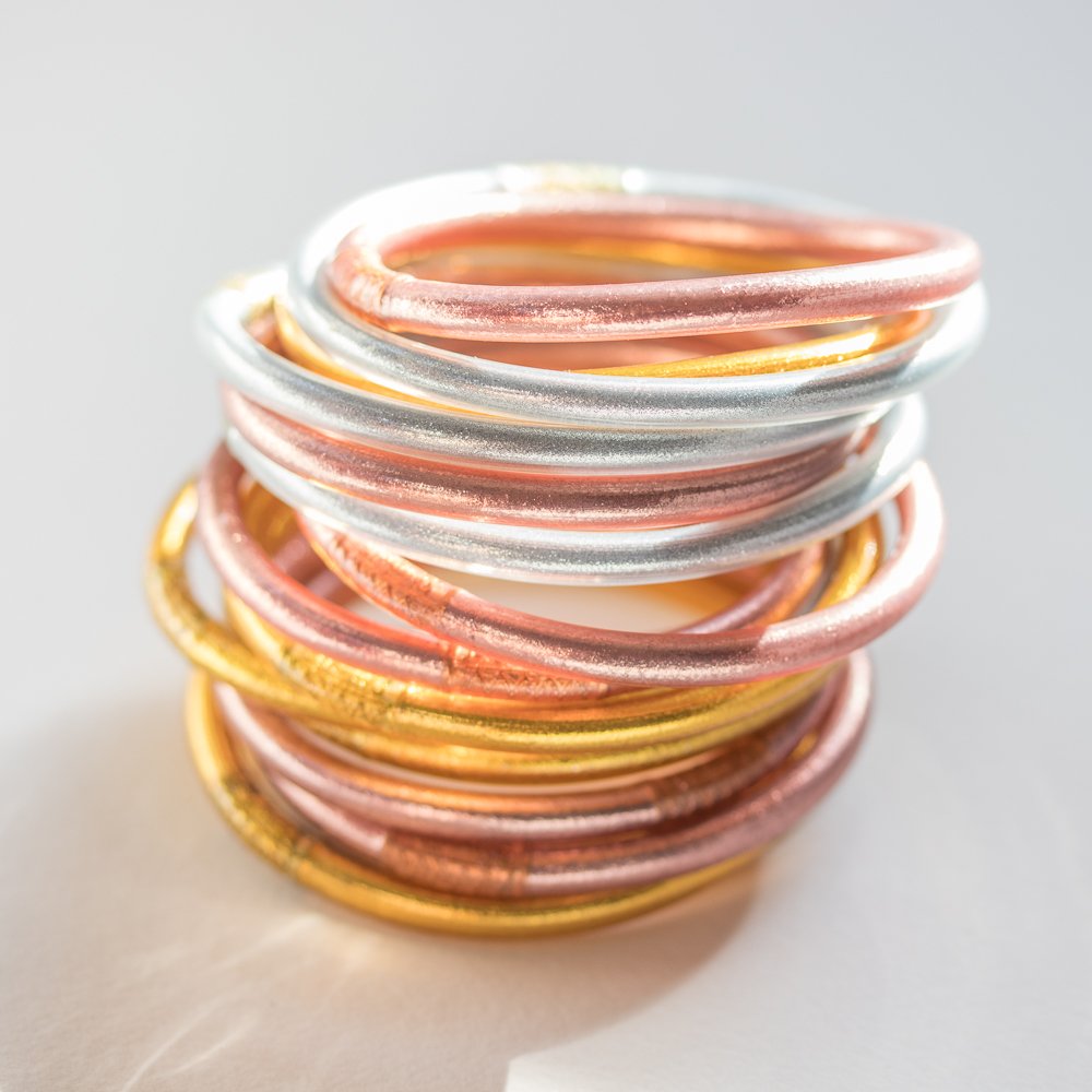 gold, silver, and rose gold bangles by BudhaGirl