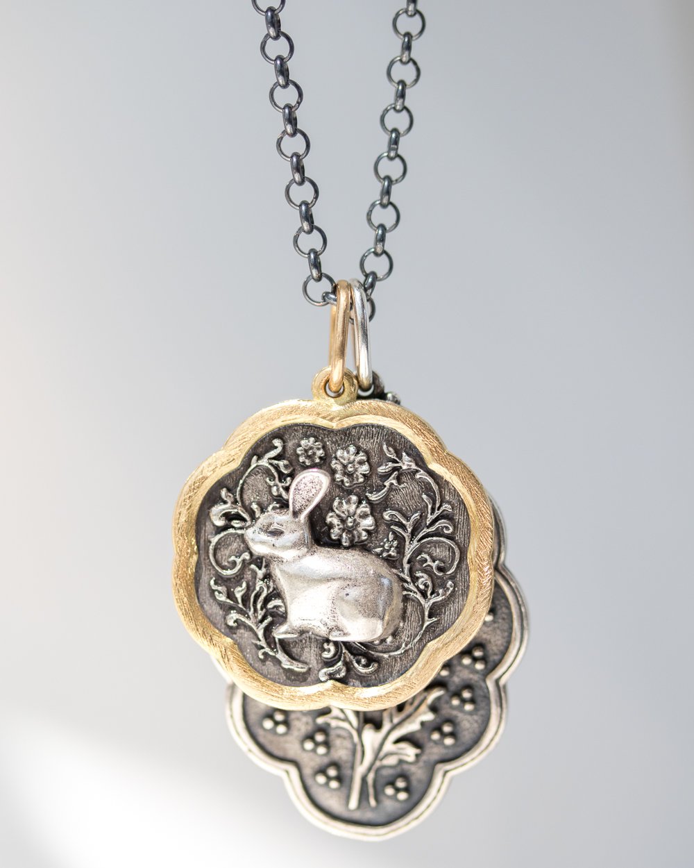 Gold and silver charms by Erica Molinari