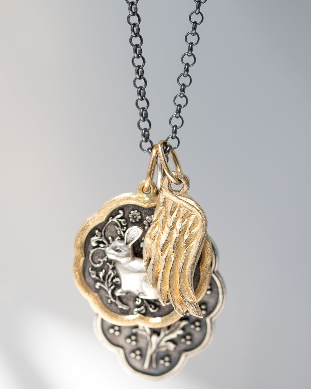 Gold and silver charms by Erica Molinari