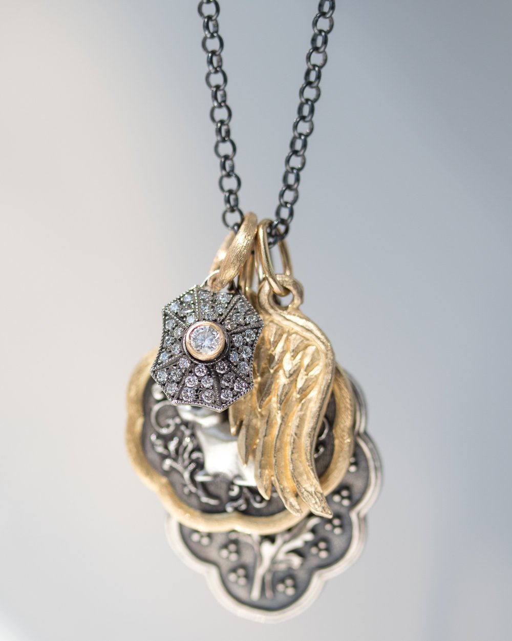 Gold and silver charms by Erica Molinari