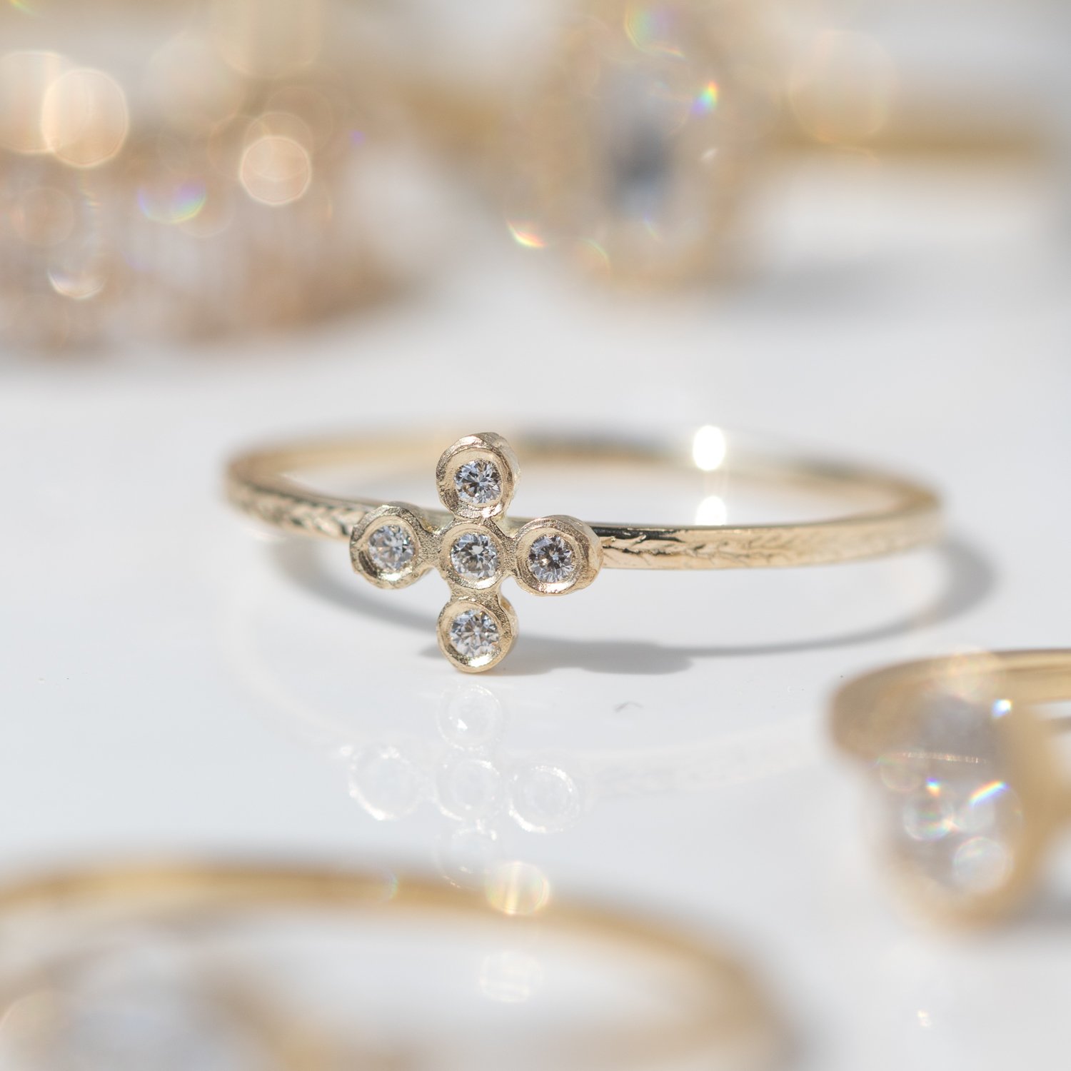 Diamond bezel cross ring by Victoria Cunningham