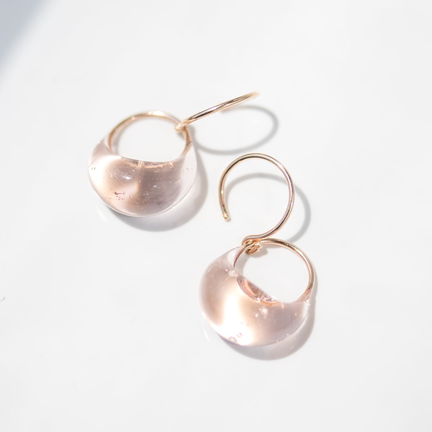 Pale beige droplet earrings in gold with glass by Jess Panza