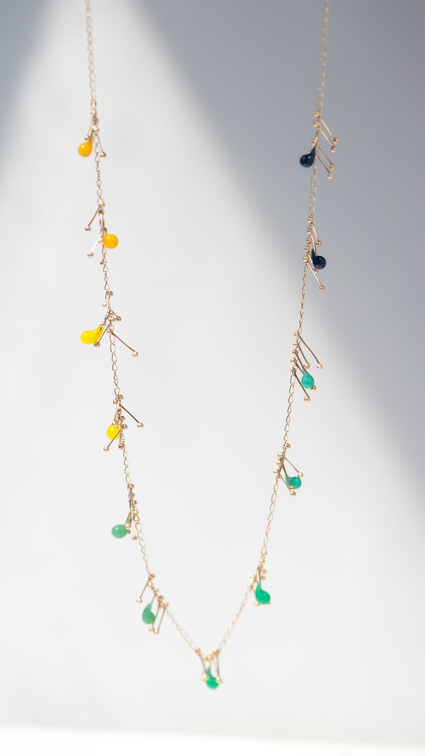Fiber optic fade necklace by Jess Panza in gold and glass