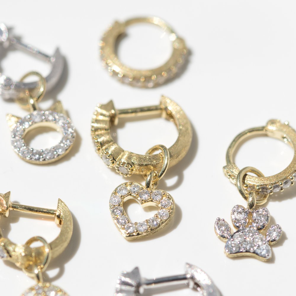 Yellow gold and white gold diamond hoops and enhancers by jewelry designer Jude Frances