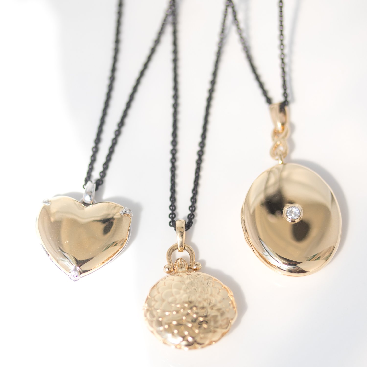 Gold lockets by jewelry designer Monica Rich Kosann