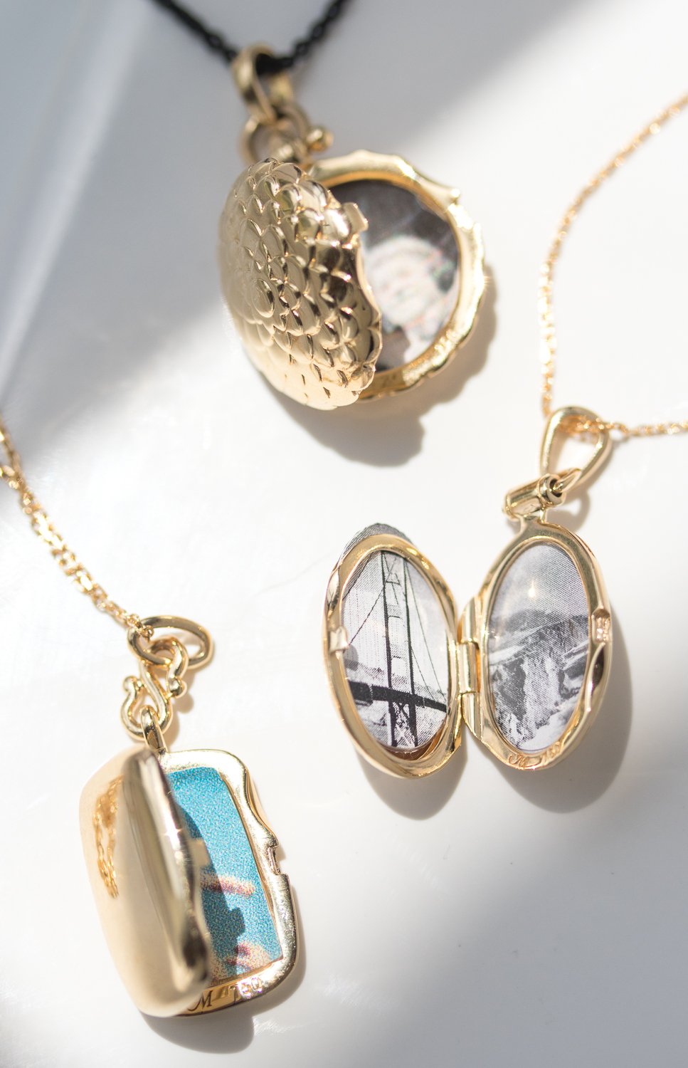 Gold lockets by Monica Rich Kosann