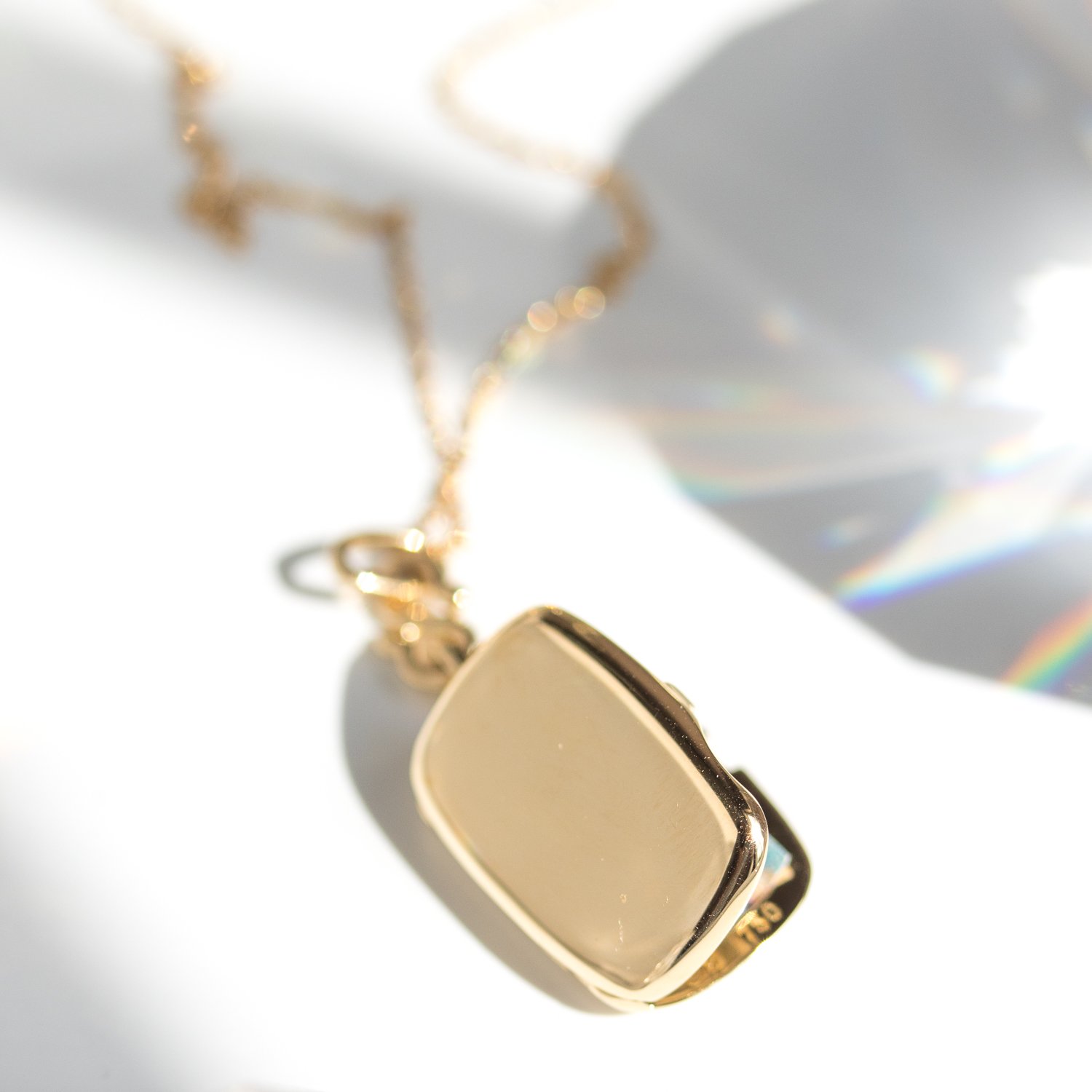 Slim brit gold locket by jewelry designer Monica Rich Kosann