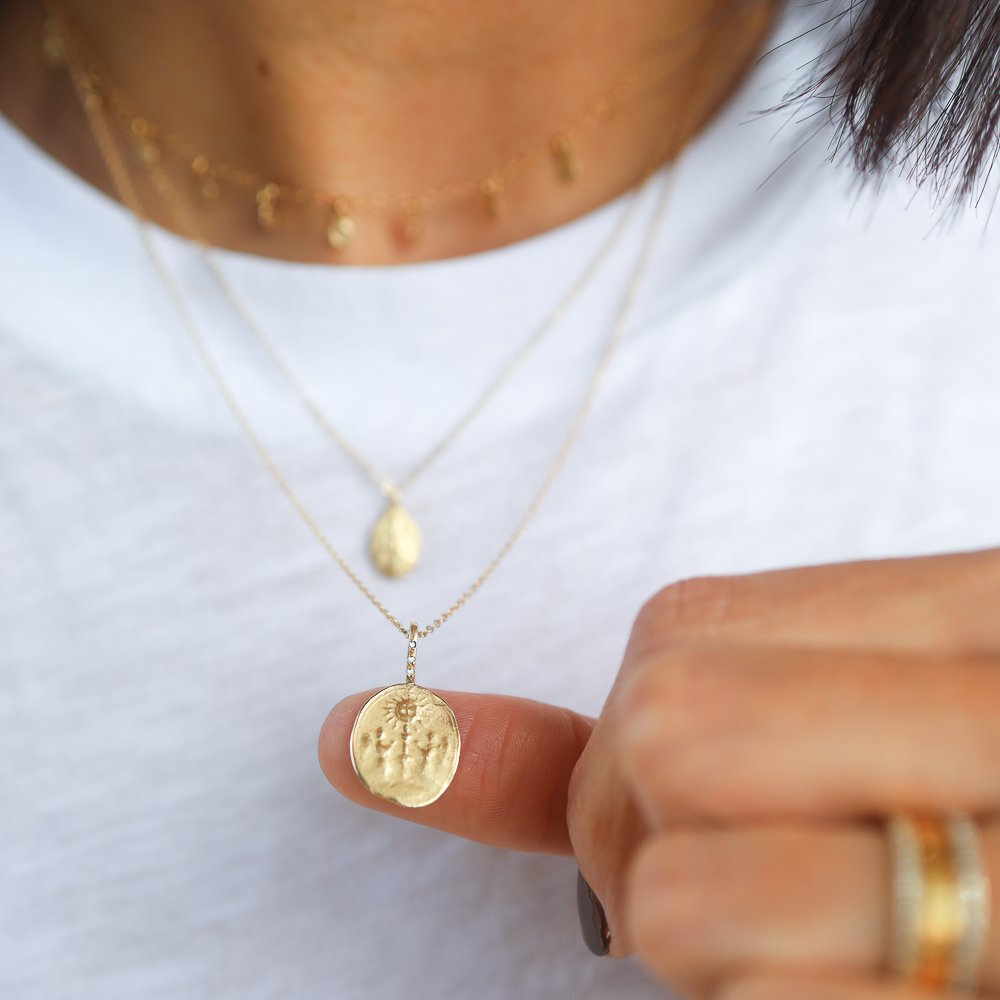 14K gold artifact necklace by jewelry designer Robin Haley