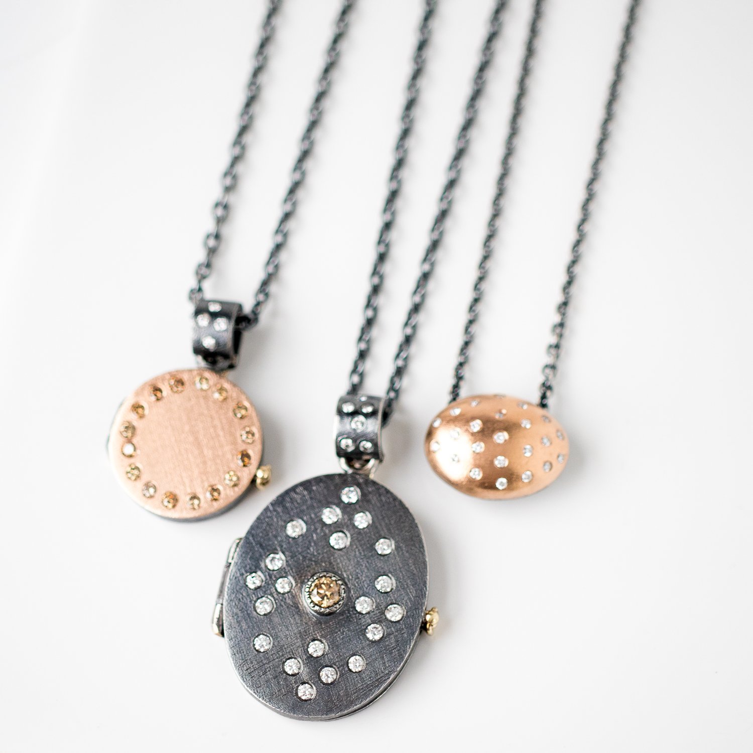 Oxidized sterling silver and gold diamond necklaces and pendants by jewelry designer Rene Escobar