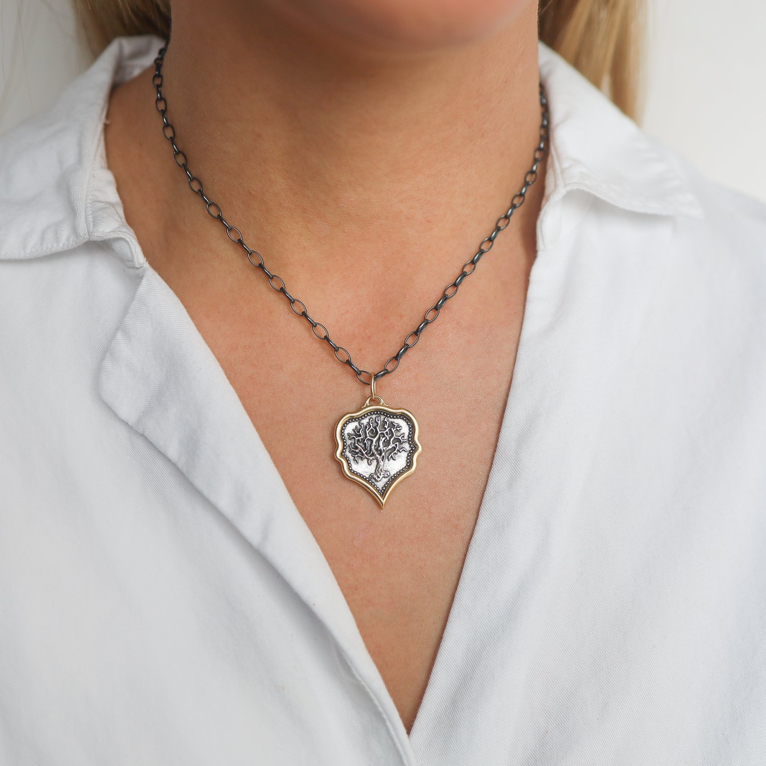 Erica Molinari: SS and 18K pointy teardrop tree of life "family, where life begins and love never ends"