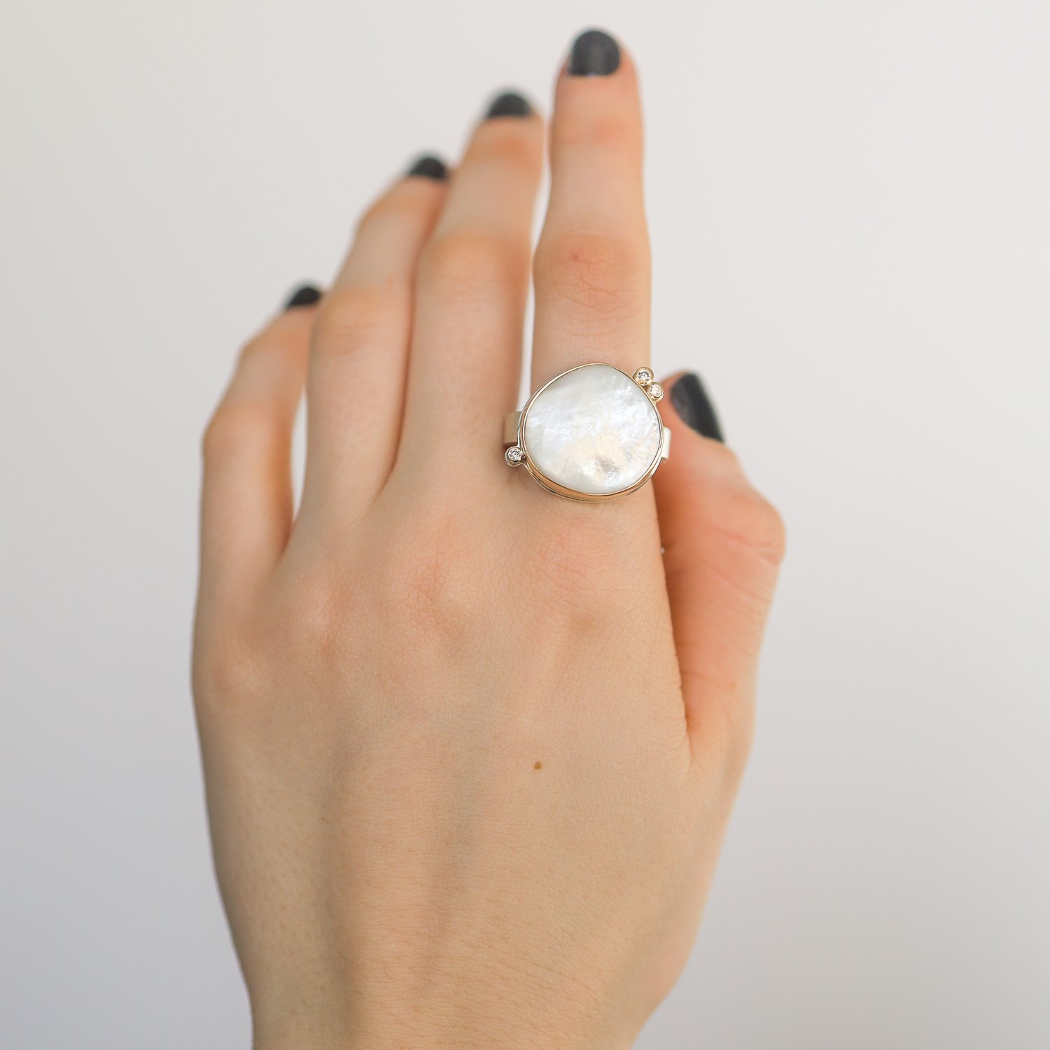 Jamie Joseph: SS & 14K gold ring w/ asymmetrical smooth mother of pearl & triple satellite diamonds on y band .08 tcw size 7 3/4