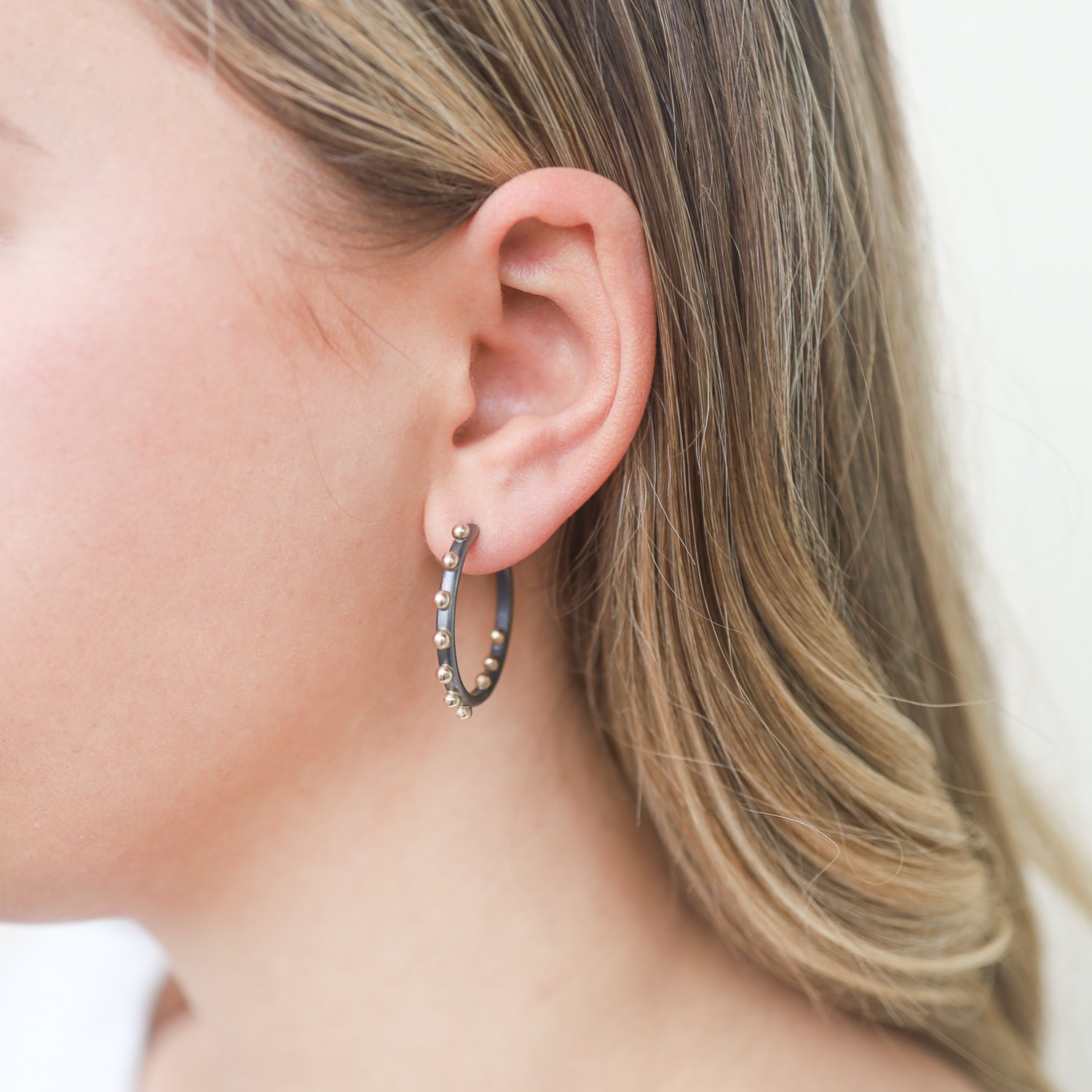 Alison Shiboski: Oxidized sterling silver and 18K 10 dot hoop earring
