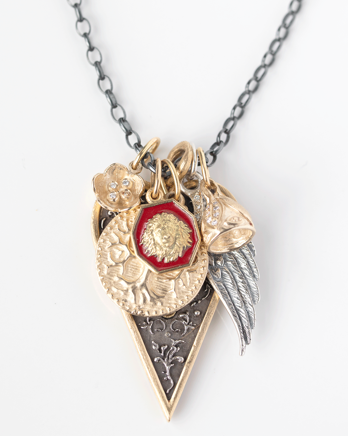 Gold and silver necklace charms by jewelry designer Erica Molinari