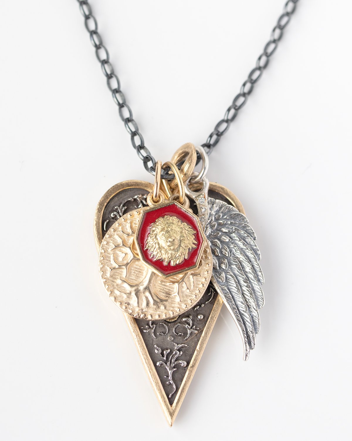 Gold, silver, and enamel necklace charms by jewelry designer Erica Molinari