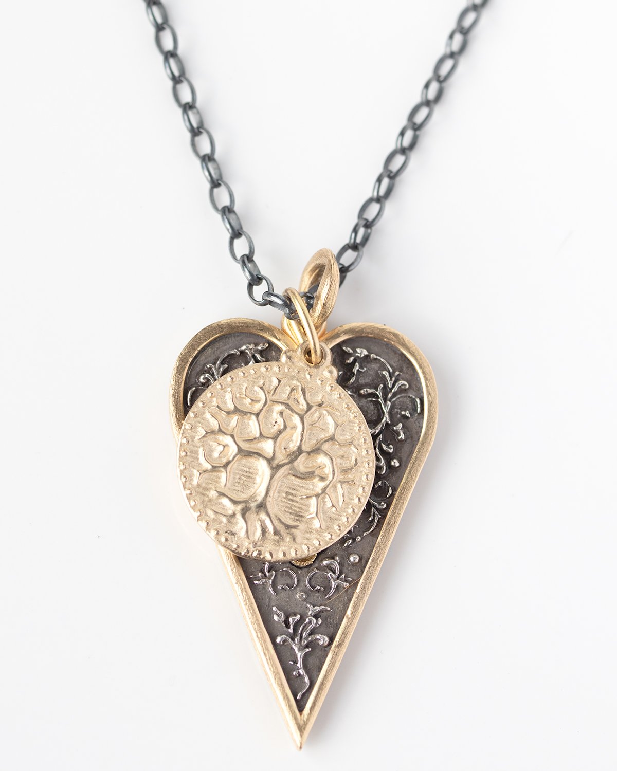 Gold, silver, and enamel necklace charms by jewelry designer Erica Molinari