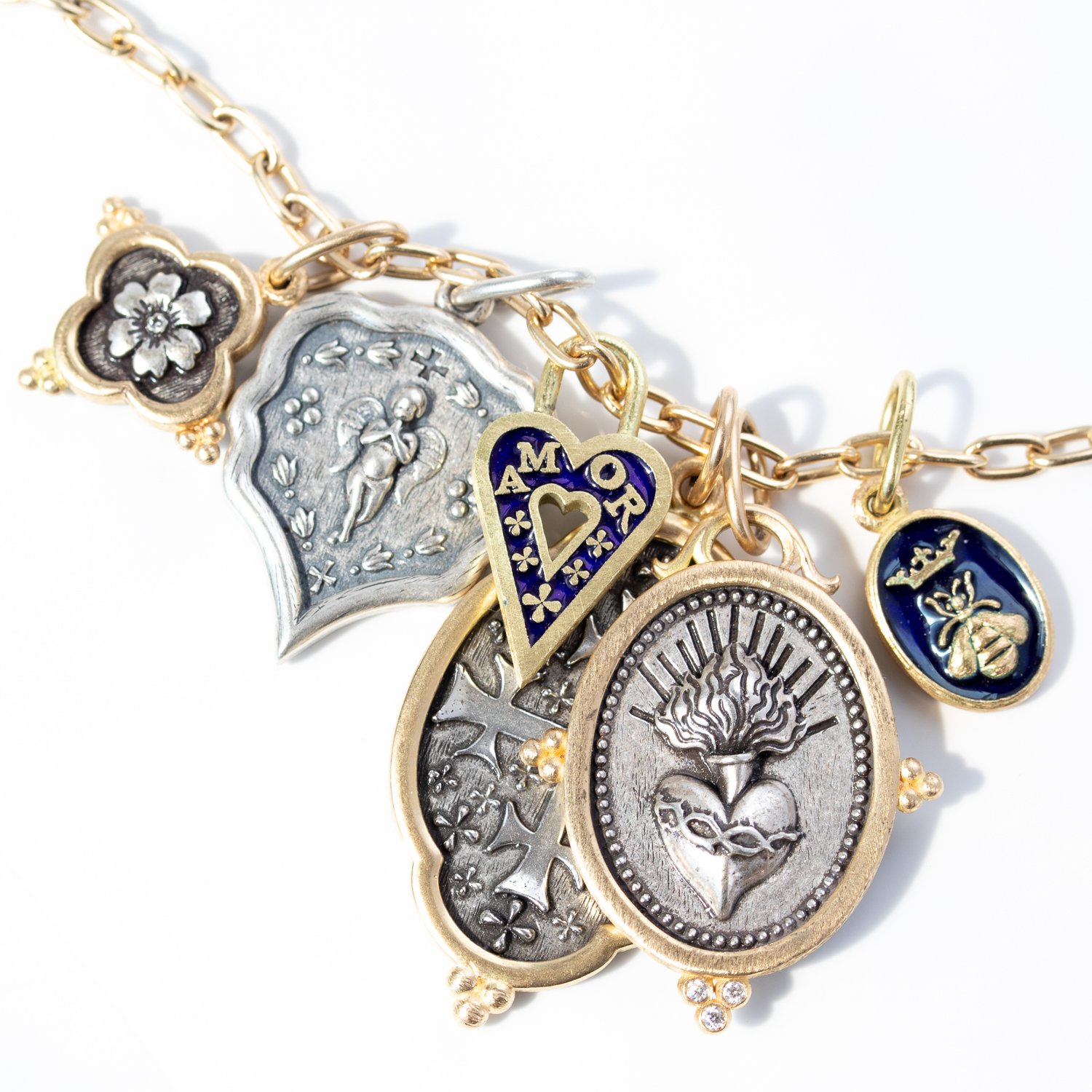 Gold, silver, and enamel necklace charms by jewelry designer Erica Molinari