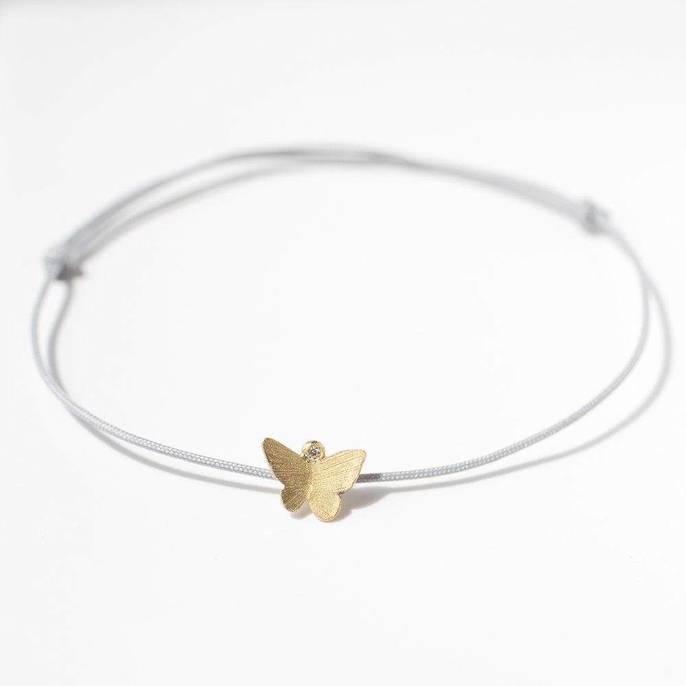 18K gold butterfly bracelet on silk cord by jewelry designer Lene Vibe