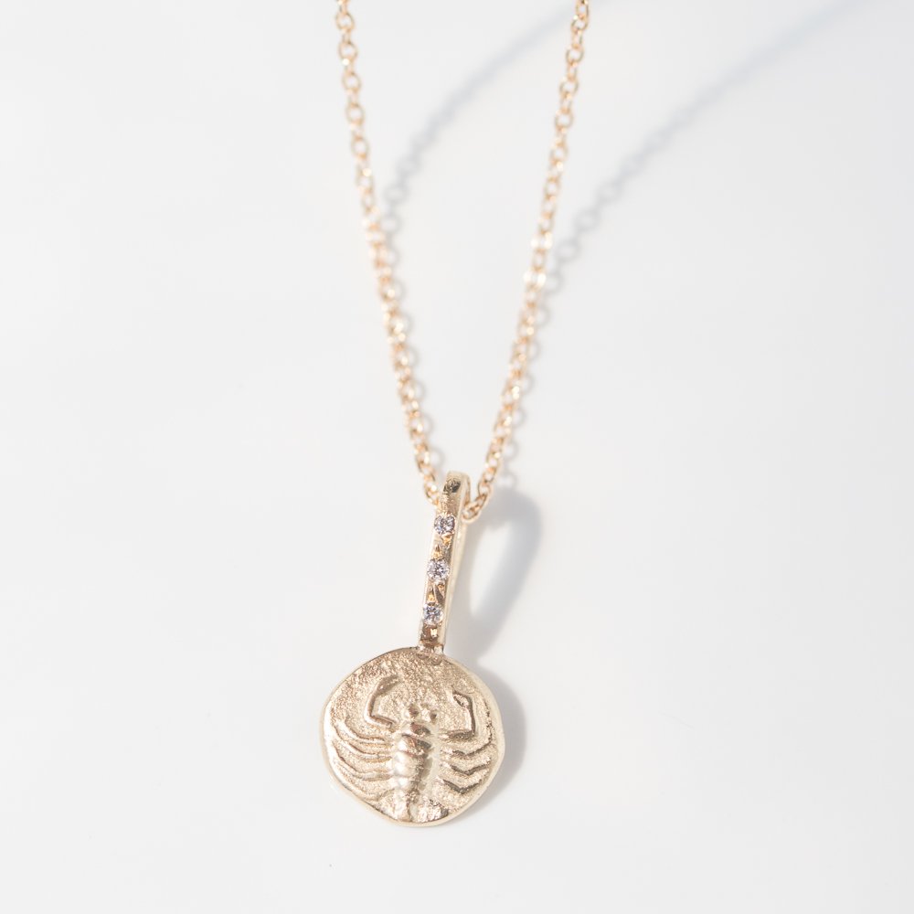 Gold coin pendant necklace by jewelry designer Robin Haley