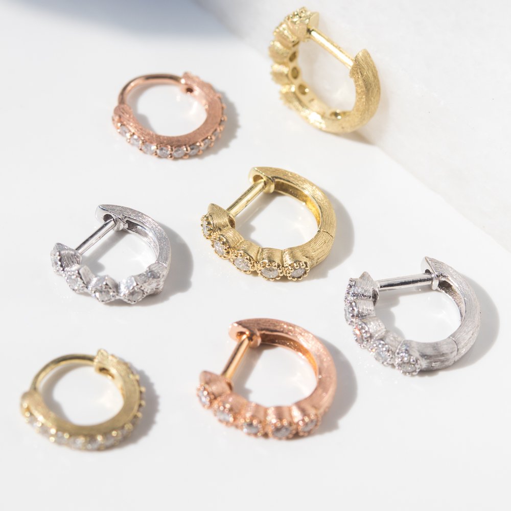 White, rose, and yellow gold diamond hoops by jewelry designer Jude Frances