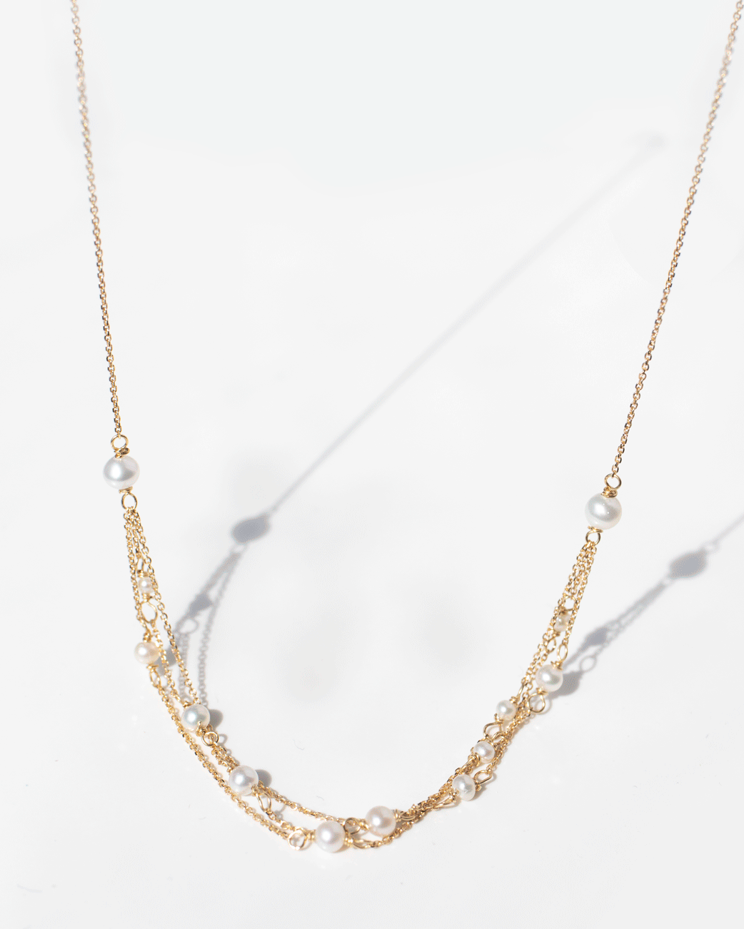 Gold and pearl necklace by jewelry designer Sweet Pea