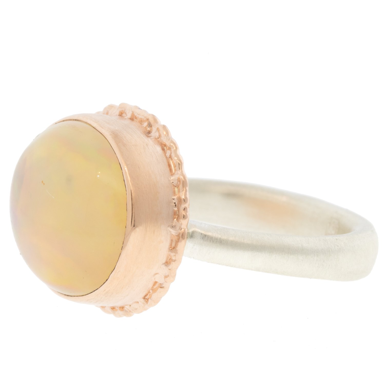 Jamie Joseph: Ring, oval, 14K ROSE gold bezel set Mexican fire opal on ruffled platform, Sterling silver Egyptian band, Stone measures 1/2″ x 5/8″, Currently available in size 7 1/2