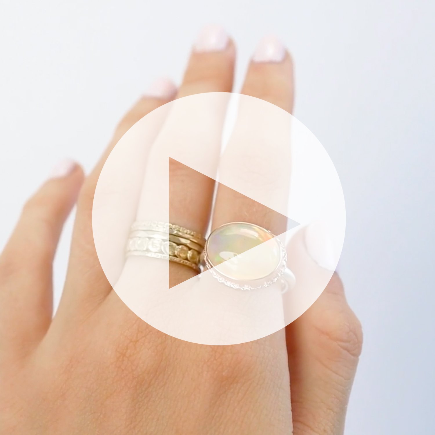 Jamie Joseph: Ring, oval, 14K ROSE gold bezel set Mexican fire opal on ruffled platform, Sterling silver Egyptian band, Stone measures 1/2″ x 5/8″, Currently available in size 7 1/2