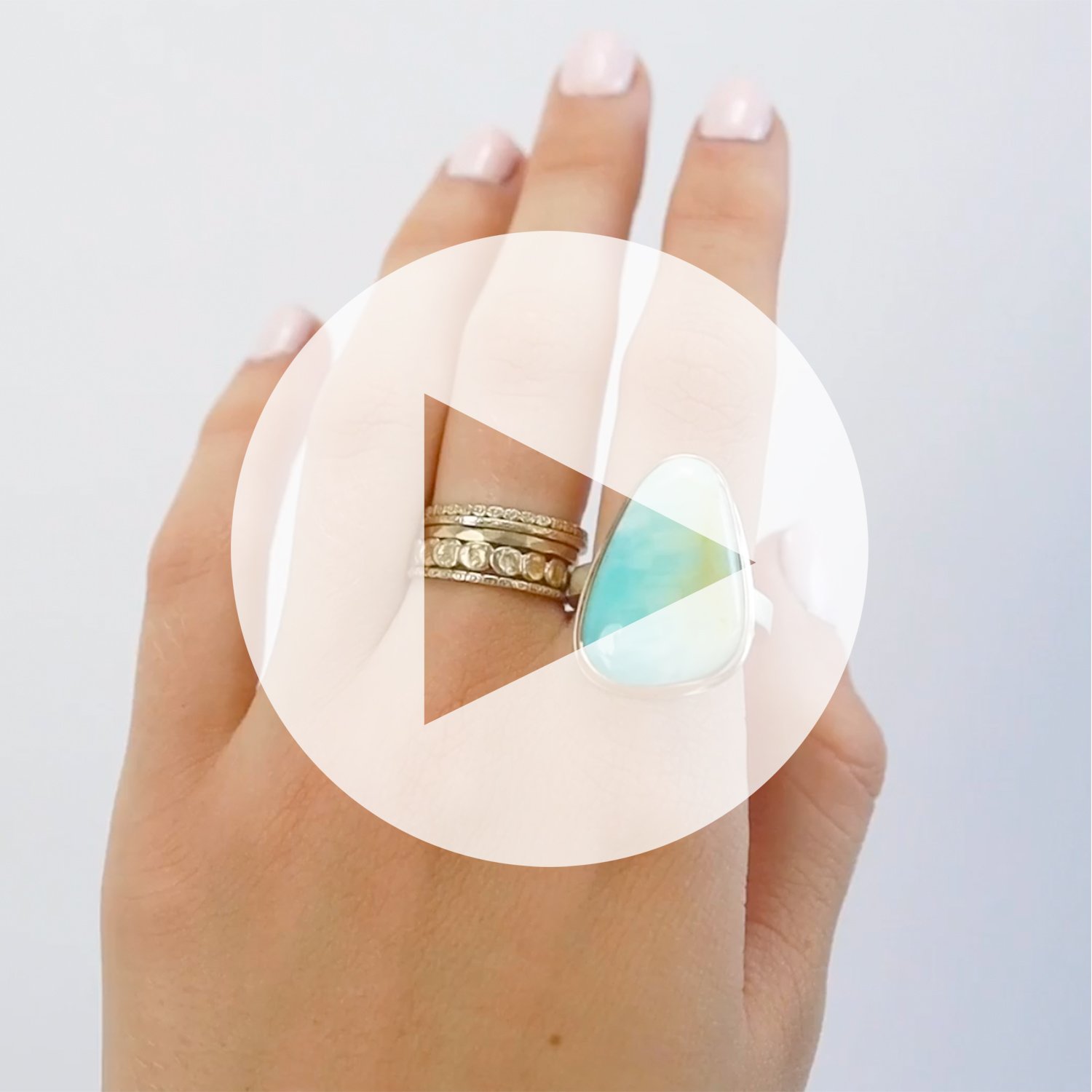 Jamie Joseph: Ring, vertical rectangular, 14K gold bezel set blue Indonesian fossilized opalized wood, Sterling silver X band, Stone measures 1″ x 5/8″, Currently available in size 7