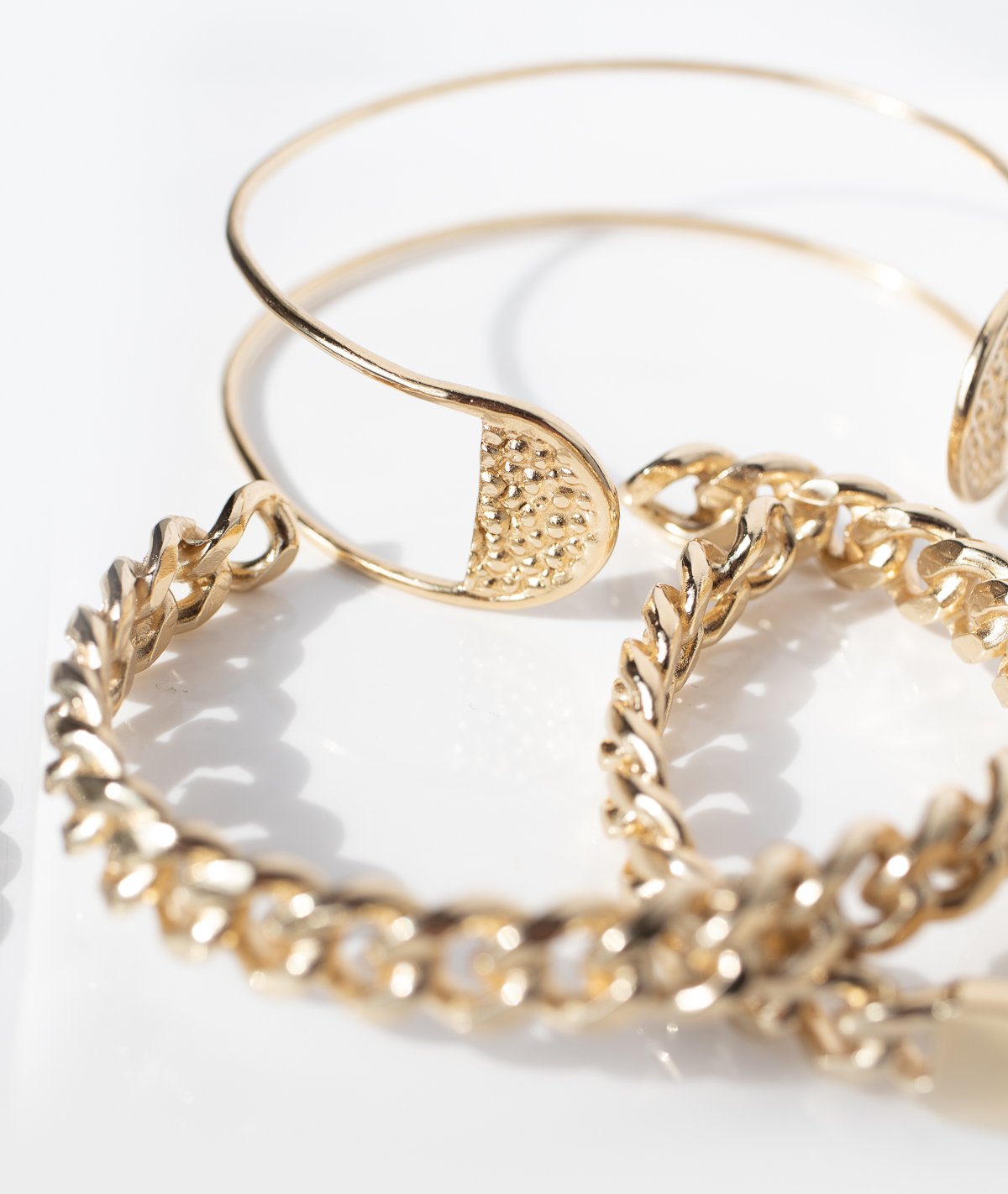 Gold bracelets and gold cuffs by jewelry designer Lauren Newton
